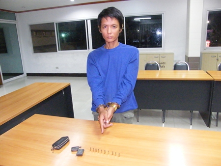 Wannarat Boonyarit points to the illegal weapon he was caught with.